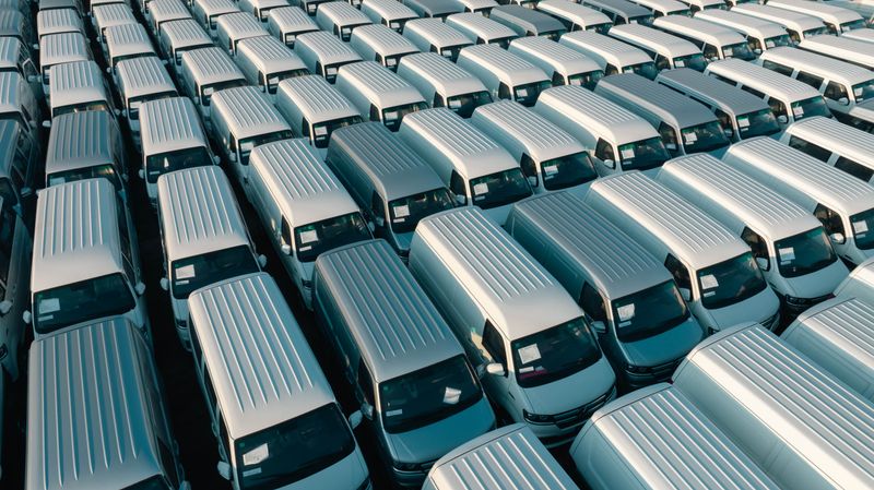 Row of service vans parked at a depot